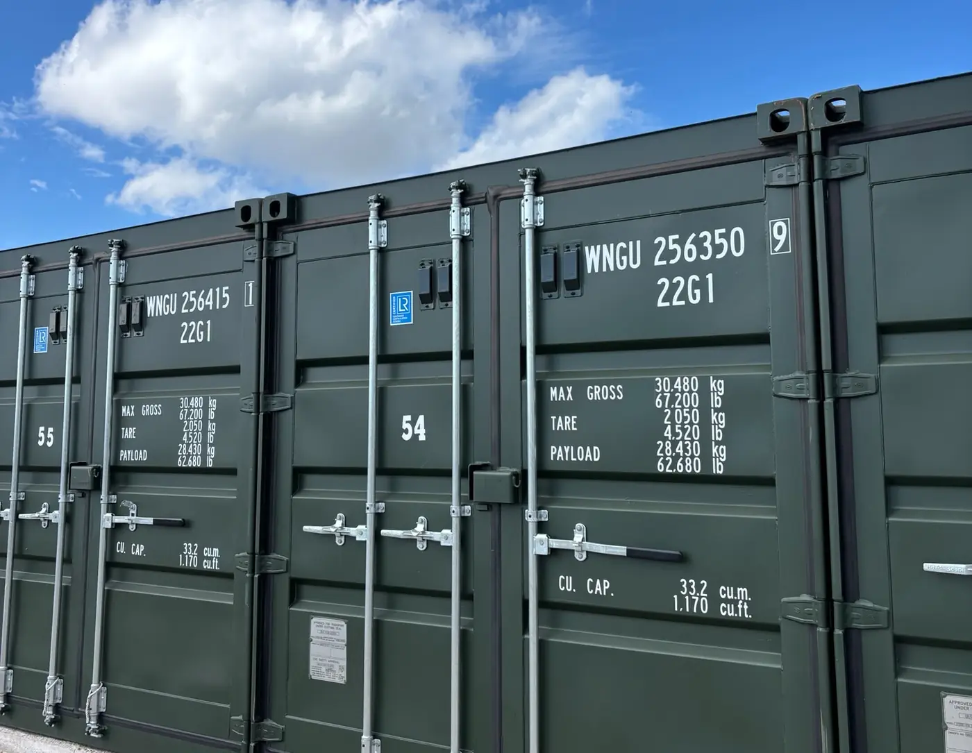 Row of green steel storage containers